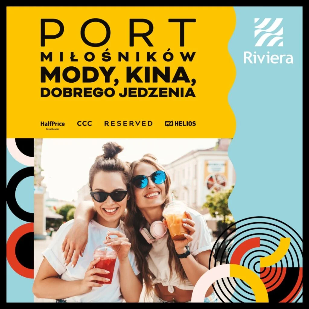 Dwie kobiety z napojami, uśmiechnięte na tle miasta.