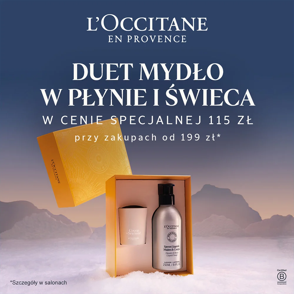 Zestaw mydło w płynie i świeca L'Occitane na tle gór.
