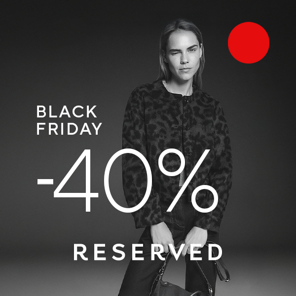 Kobieta w czarnej kurtce, promocja Black Friday -40% w Reserved.