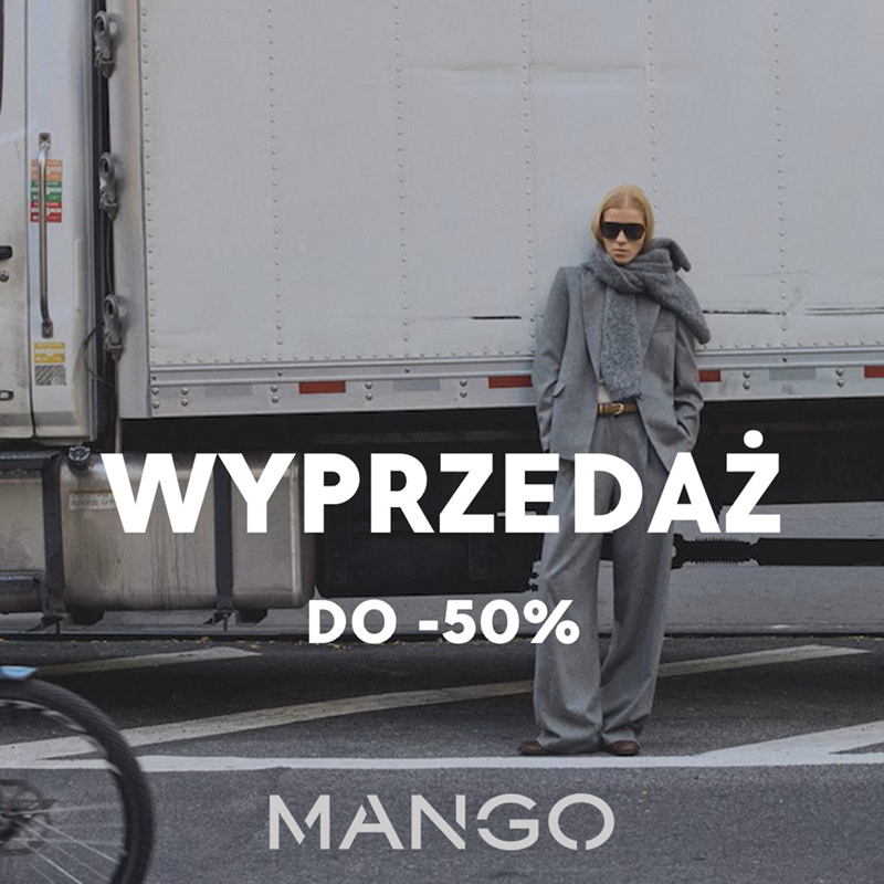 Kobieta w szarym płaszczu na tle ciężarówki, wyprzedaż do 50%.