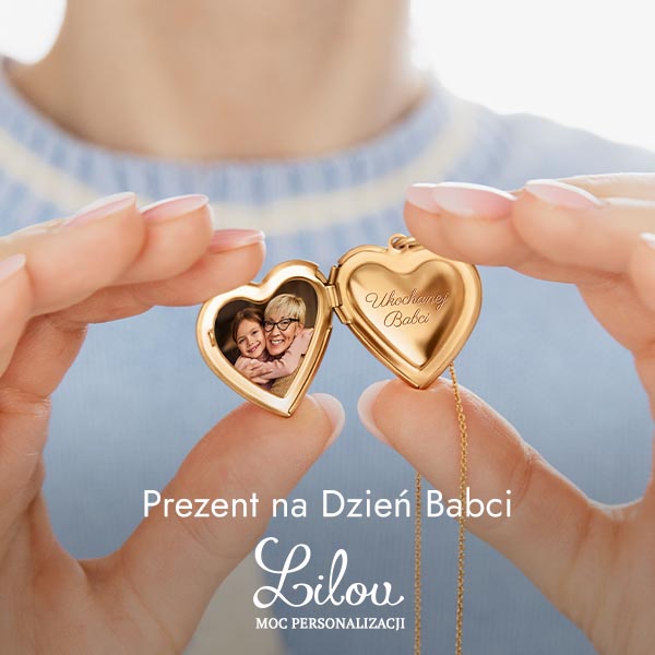 Złoty naszyjnik w kształcie serca z napisem 'Ukochanej Babci'.