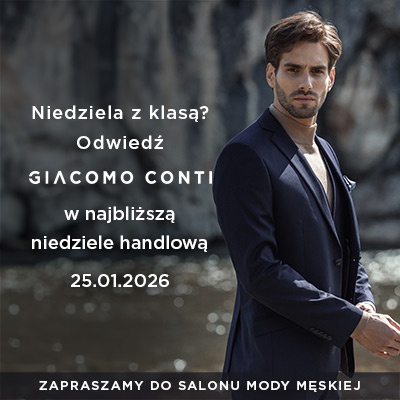 Mężczyzna w eleganckim garniturze na tle natury.