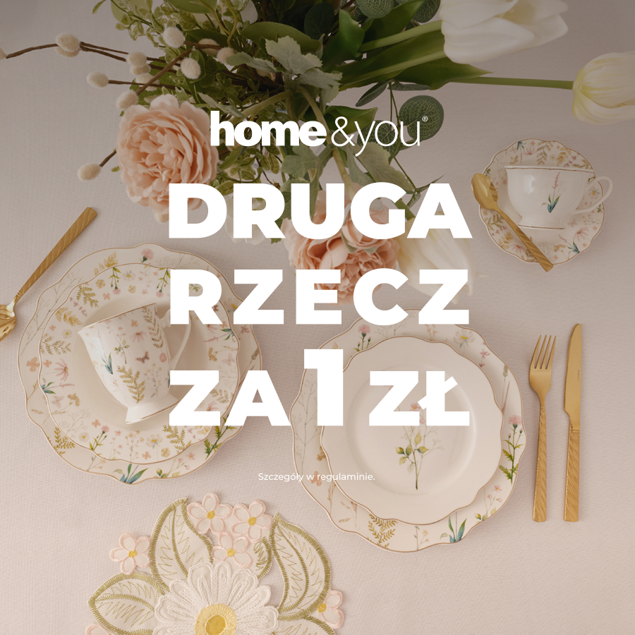 Zestaw stołowy z kwiatowym wzorem na stole.